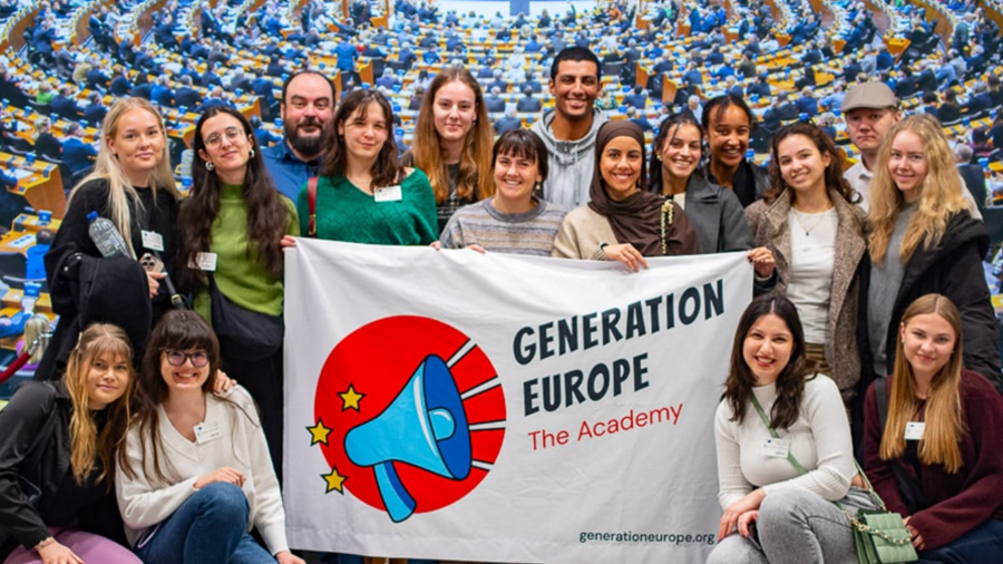 A group of young people hold up a banner reading “Generation Europe.”
