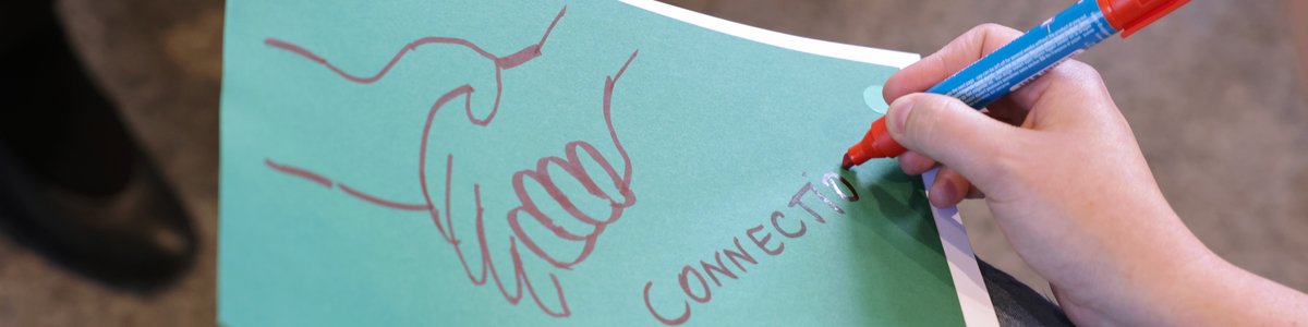 Someone writing connection on a sheet