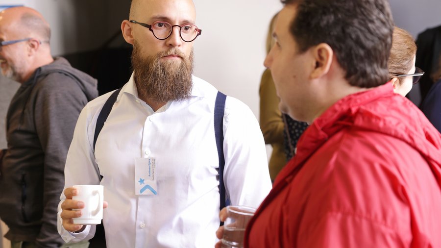 Two men are talking to each other.