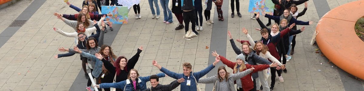 A group of people create a heart
