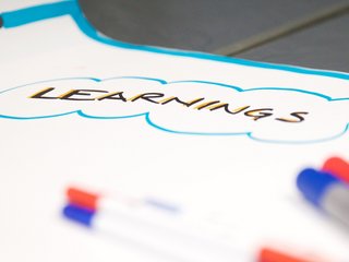 Learnings is written on a poster.